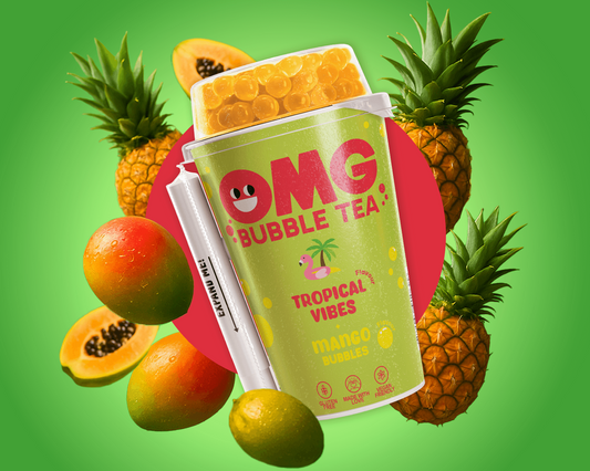 Green bubble tea cup with tropical fruits on a green background